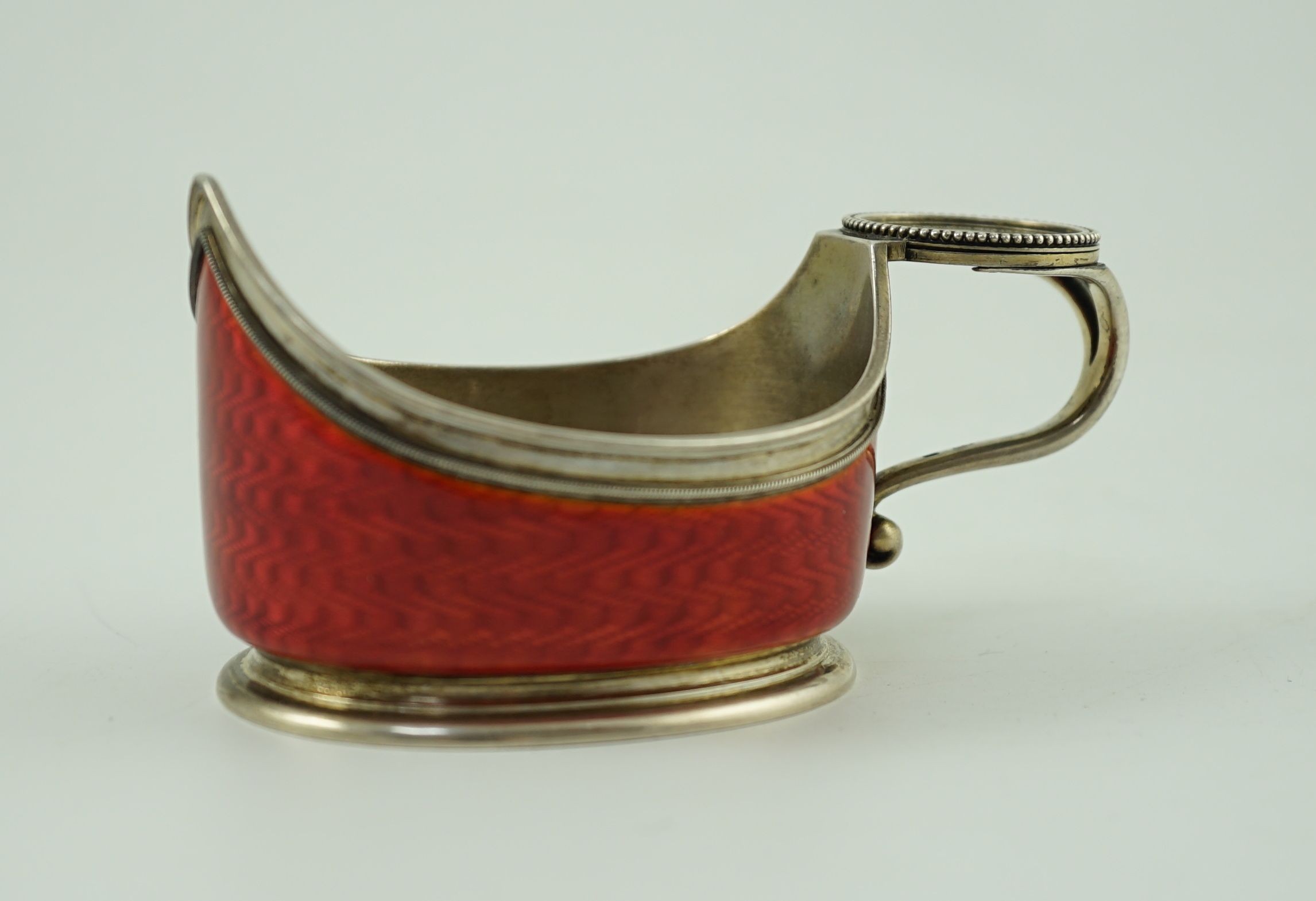 CARL FABERGE: A late 19th/early 20th century 88 zolotnik and red guilloche enamel oval kovsh, work master Anders Johan Nevalainen